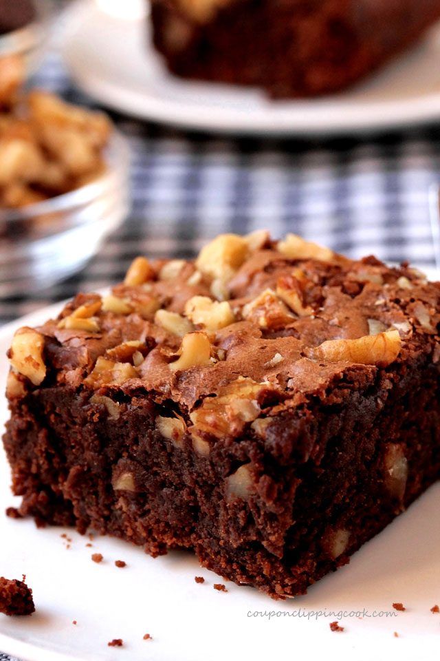 a piece of chocolate brownie on a white plate