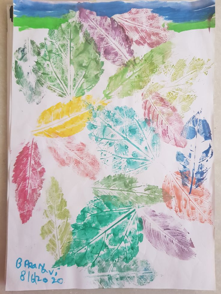 an art project with leaves painted on paper