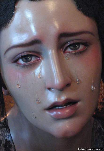 a mannequin head with tears on it's face