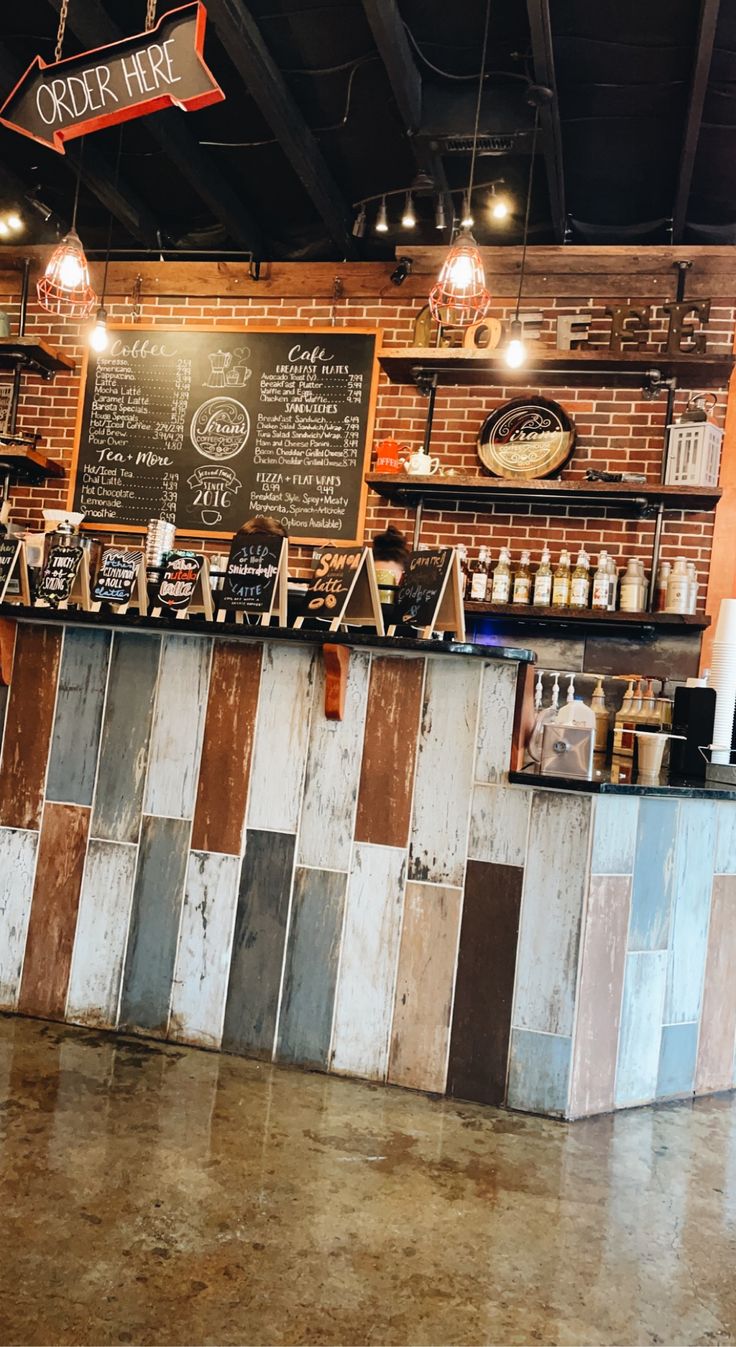 the inside of a coffee shop with lots of counter space