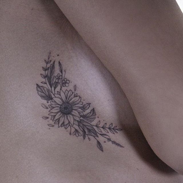 a woman's chest with flowers on it