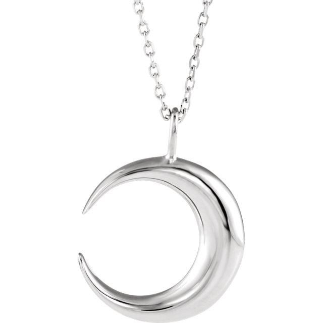 a silver crescent pendant on a chain