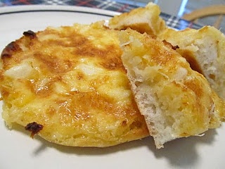 an omelet is cut in half on a plate