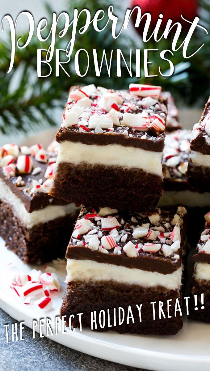 peppermint brownies with white frosting and candy canes on a plate