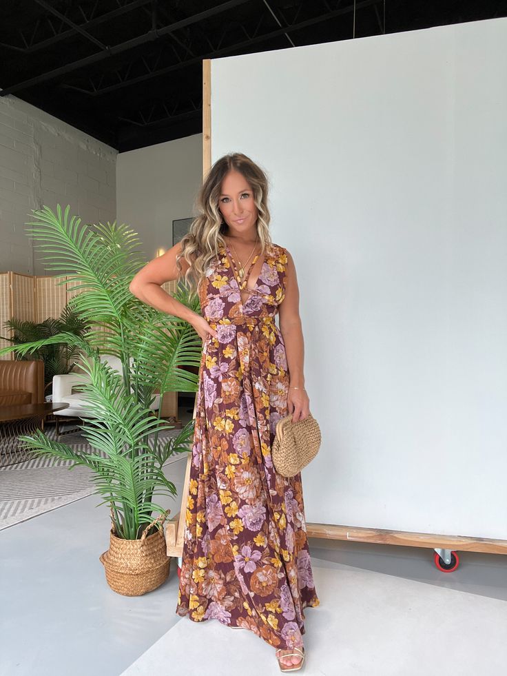 Details Deep V-Neckline Floral Maxi Dress with Chest Strings and Open Side Detailing Lined Color: Brown Multi Material: 100% Polyester Size Runs True to Size Model is Wearing a Size Small Model Measurements Size: 4 Height: 5'2" Weight: 135lbs Bust: 35" Waist: 26" Hips: 35" Bra Size: 34C Brown Floral Print V-neck Dress, Brown V-neck Summer Maxi Dress, Summer Brown V-neck Maxi Dress, Brown V-neck Summer Sundress, Brown V-neck Sundress For The Beach, Brown V-neck Beach Dress, Brown V-neck Sundress For Vacation, Brown V-neck Maxi Dress For Beach, Brown V-neck Sundress