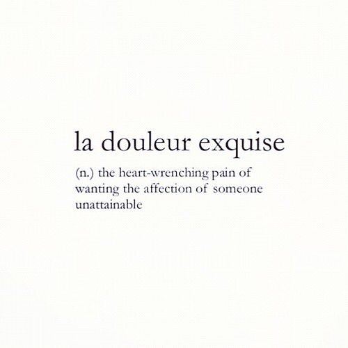 the words la douleur exquise are written in black ink on white paper