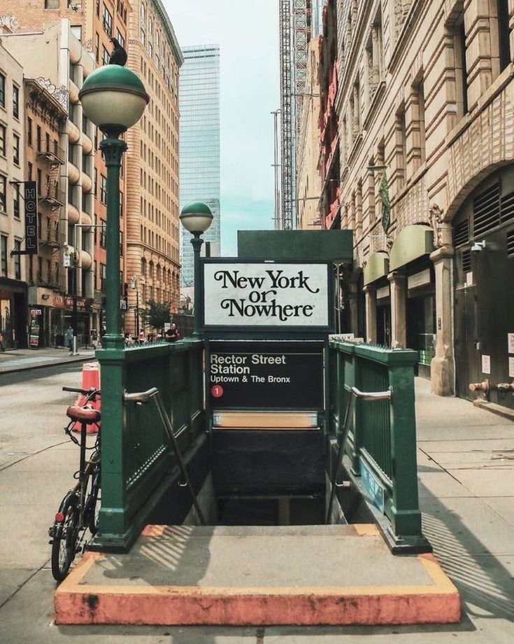 a bicycle parked at the entrance to new york nowhere