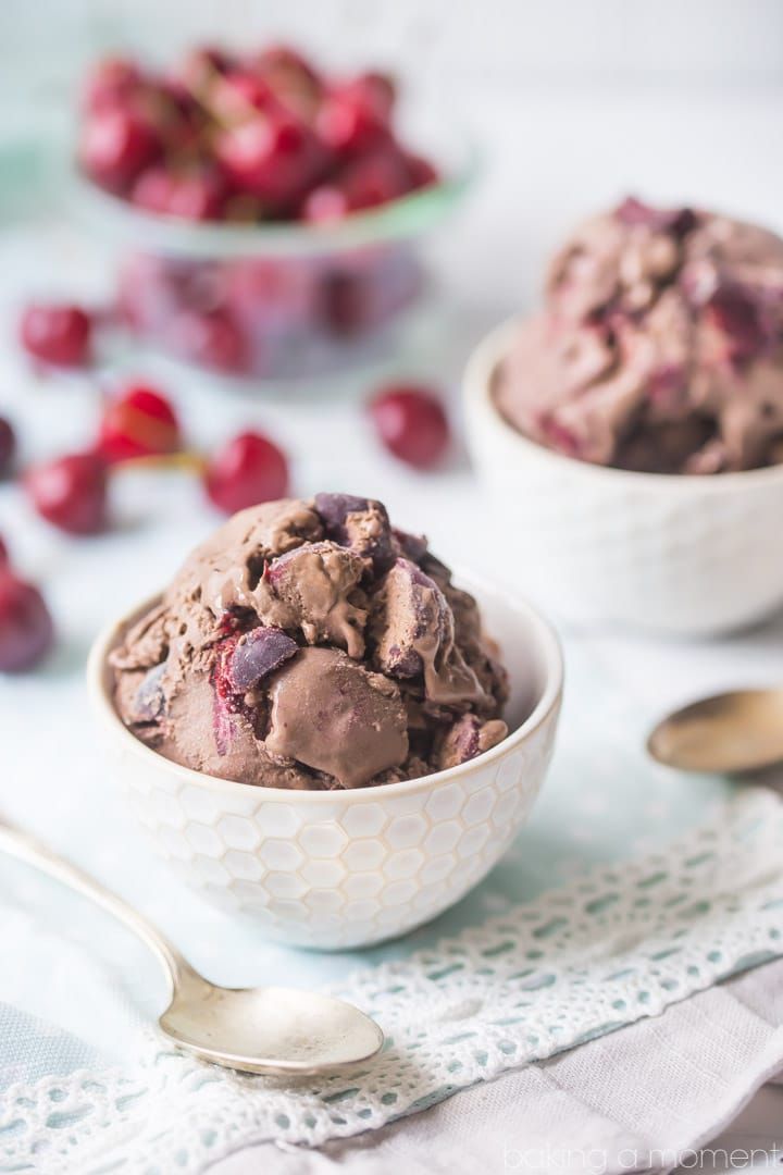 two bowls filled with ice cream and cherries