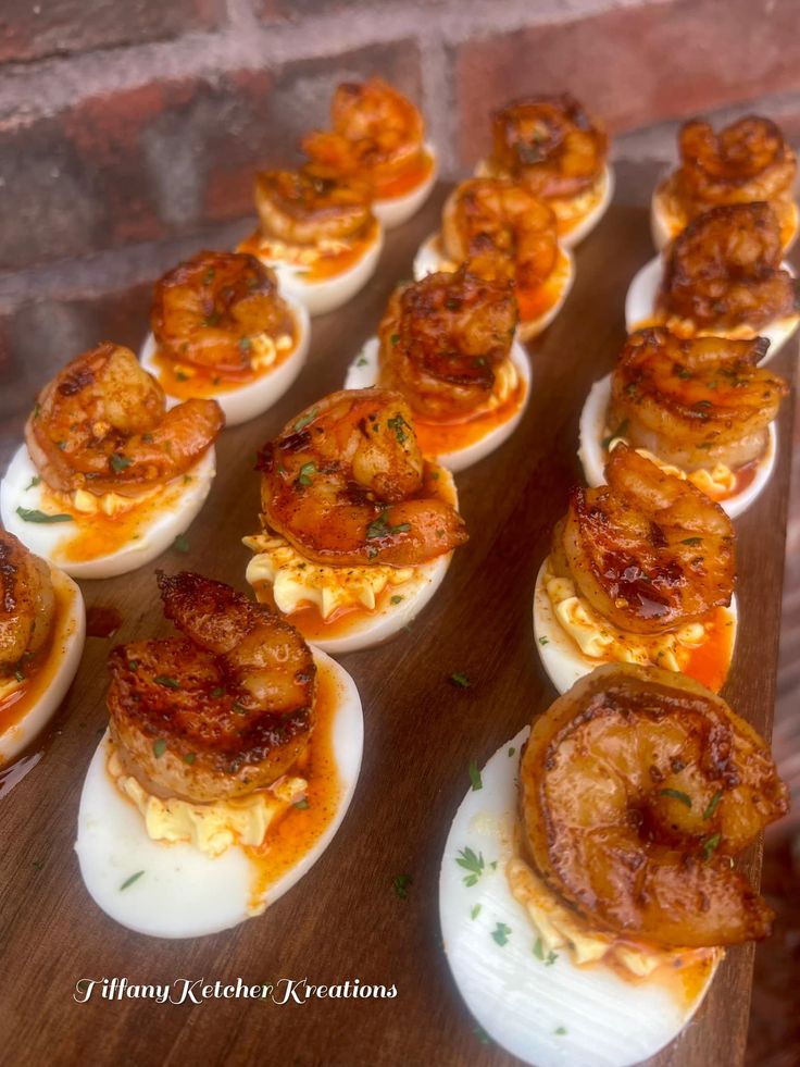 there are many deviled eggs with shrimp on them