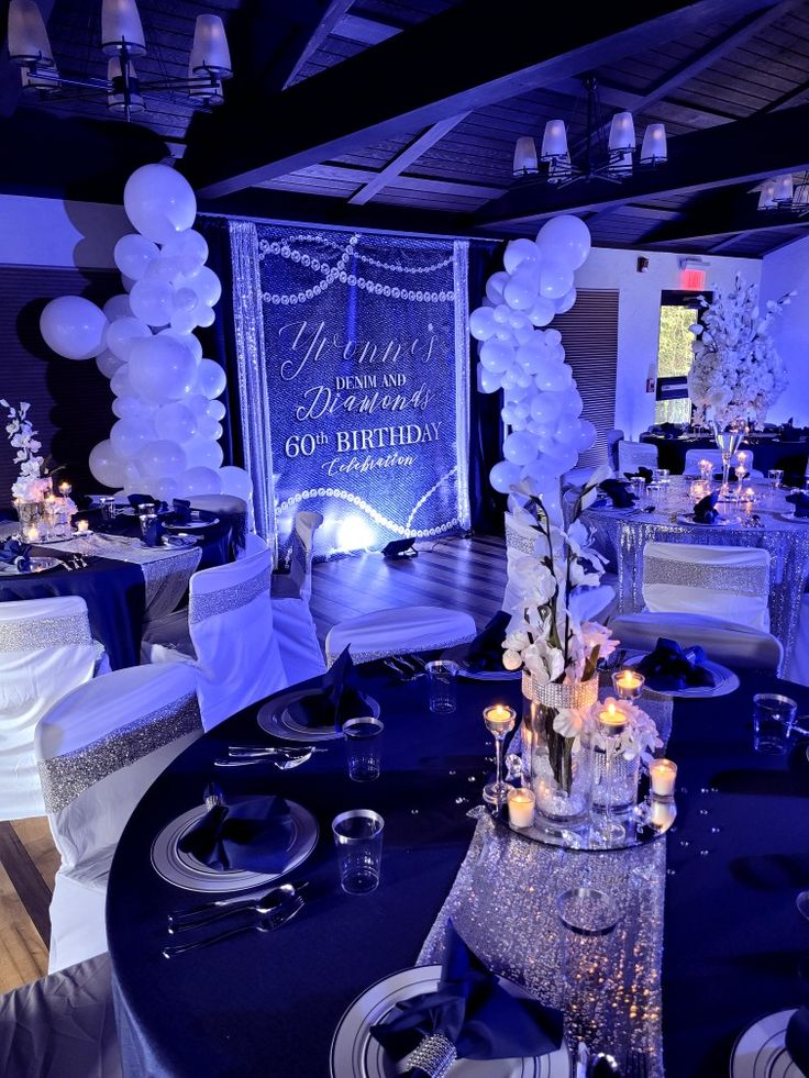 a table with white and blue decorations on it