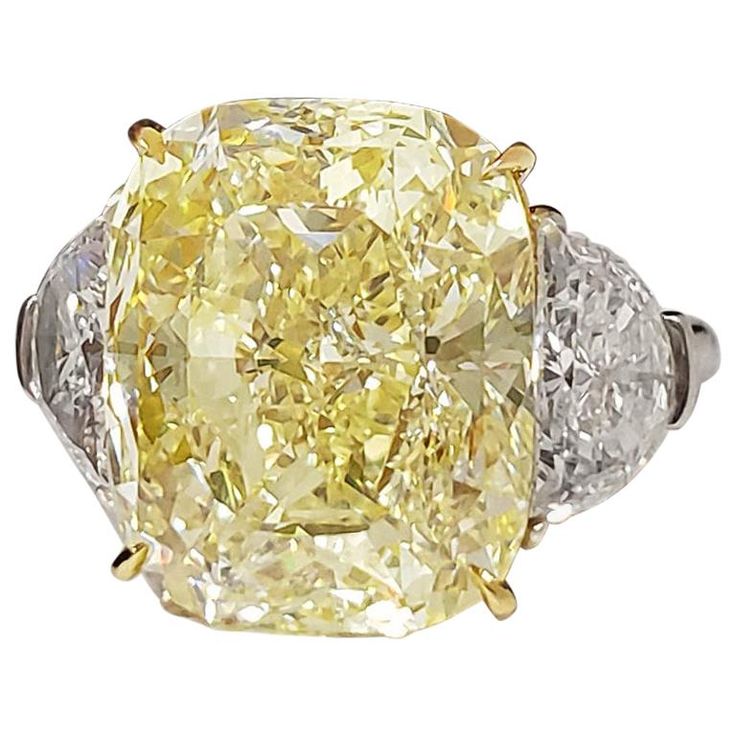 From SCARSELLI the world-renowned Natural Fancy Color diamonds, this 11-carat Fancy Yellow cushion cut diamond set in an 18k yellow gold and platinum ring flanked by half-moons E VS1 diamonds totaling 1.46ct Wonderfully tailored, this ring transitions from day to evening seamlessly (see certificate pic for detailed main stone's information). This ring may be sized or the diamond re-designed with Scarselli to suit the client's specifications. For this and other spectacular natural fancy color dia Fancy Yellow Diamond Ring, Radiant Diamond Rings, Radiant Cut Diamond Ring, Radiant Ring, Canary Diamond, Yellow Diamonds Engagement, Yellow Diamond Engagement Ring, Emerald Cut Diamond Ring, Platinum Diamond Engagement Rings