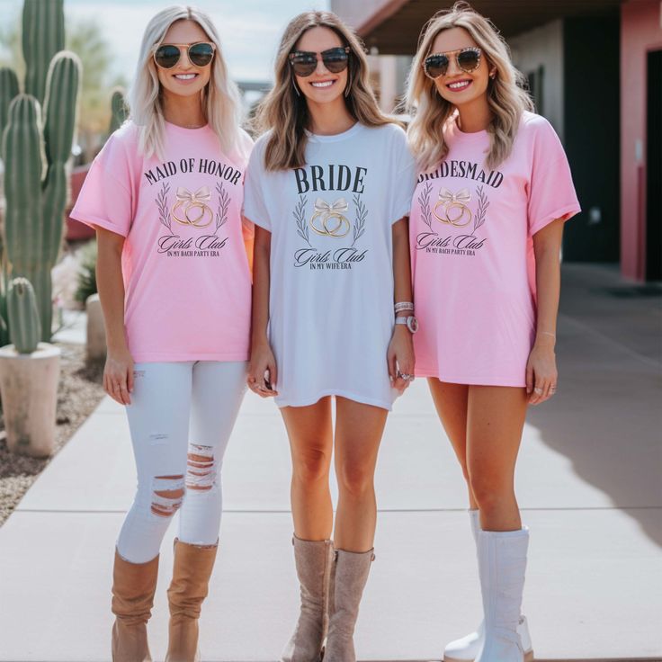 Join the Bridal Party Girls Club with these fun tees, perfect for your bachelorette party era! Show off your squad and get ready to party with these cute and trendy shirts. No one will question who the girls are when you all rock these tees! Design is Printed Direct to Garment. See Size Guide for Bella Unisex Tee Graphic Print Short Sleeve Shirt For Bachelorette Party, Summer Fitted T-shirt For Bachelorette Party, Casual Pink T-shirt For Bachelorette Party, Graphic Tee T-shirt With Letter Print For Bachelorette Party, Pink Graphic Print T-shirt For Bachelorette Party, Pink Bride, Girls Club, Trendy Shirts, Party Girls