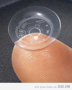 a person's finger with a plastic ring on it