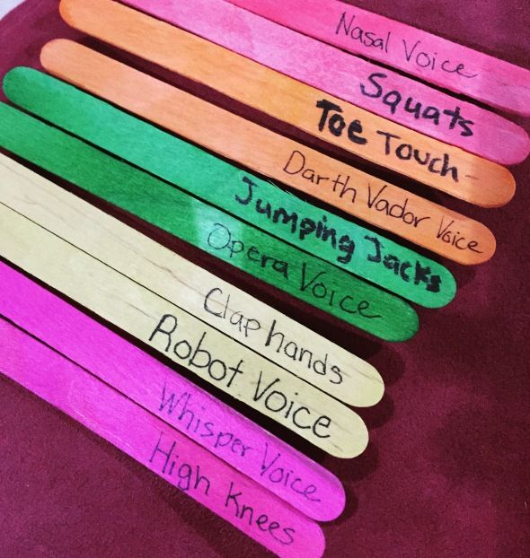 several popsicle sticks with writing on them