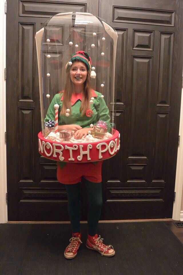 a woman holding a tray with food in it and wearing an elf costume on her head