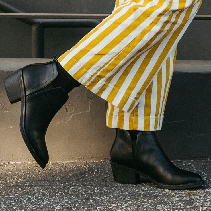 Step up your style game with the Rocket Dog York Black Bootie. 🔥 This sleek and edgy slip-on bootie features a black faux leather upper, a rubber sole with a chunky stacked heel measuring 2.2 inches, and a convenient pull-on style with a back pull tab and elastic gore entry. Perfect for adding a touch of sophistication and attitude to any outfit, pair these booties with your favorite jeans or a trendy skirt. Shop now and rock your look with Rocket Dog! 🌟 Style: Rocket Dog women's boot Style: S Ankle-high Synthetic Moto Boots For Fall, Synthetic Ankle-high Moto Boots For Fall, Casual Stacked Heel Platform Boots For Fall, Trendy Chelsea Boots With Pointed Toe And Reinforced Heel, Trendy Chelsea Boots With Reinforced Heel And Pointed Toe, Casual Platform Boots With Stacked Heel For Work, Casual Faux Leather Boots With Block Heel, Fall Synthetic Ankle Moto Boots, Casual Chelsea Boots With Pointed Toe For Fall