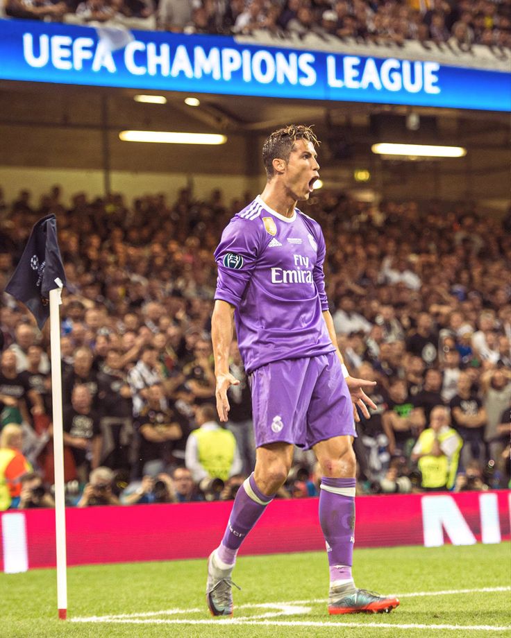 the soccer player is celebrating his goal in front of an audience at a sporting event