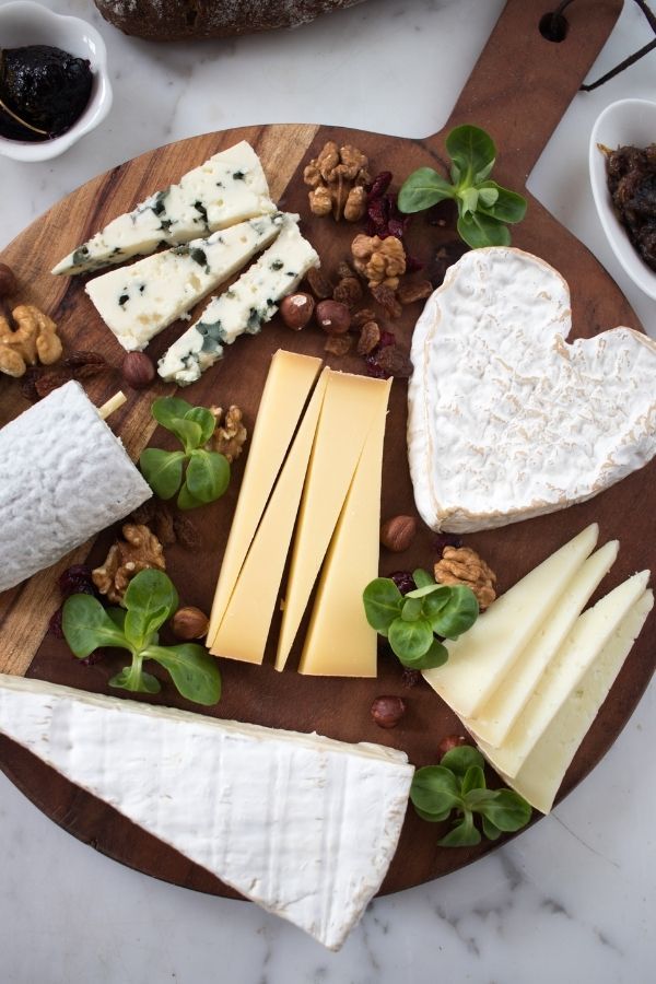 cheese platter with different types of cheese on it