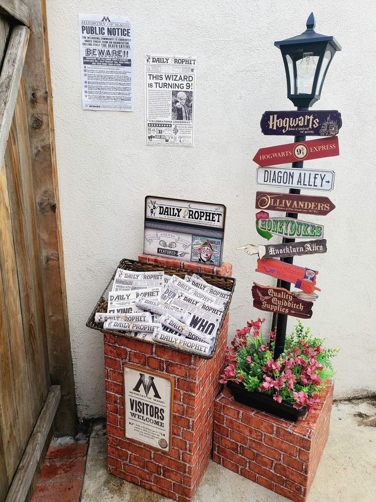 a bunch of signs that are on the side of a building in front of a door