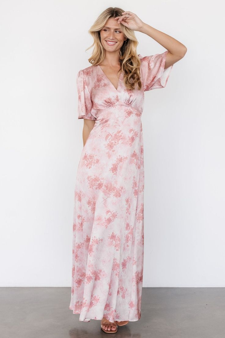 Look and feel beautiful with our Carmen Maxi Dress Blush Floral. The romantic style and dainty floral print of this dress make it a perfect pick for your next event. Elegant Pink Maxi Dress With Flutter Sleeves, Feminine Flowy Floral Dress With Short Sleeves, Short Sleeve Floral Summer Formal Dress, Formal Pink Short Sleeve Maxi Dress, Formal Floral Print V-neck Dress, Formal Short Sleeve Floral Dress For Spring, Elegant Pink V-neck Floral Dress, Formal V-neck Floral Print Dress, Formal Floral Dress With V-neck