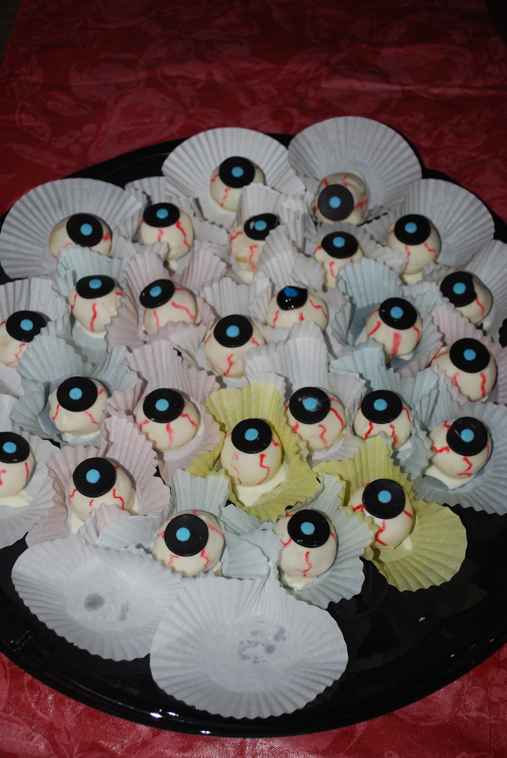 there are many cupcakes with eyes on them