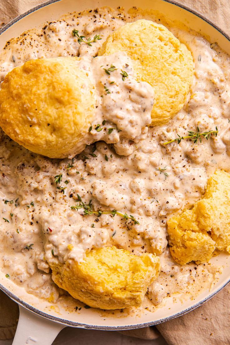 biscuits and gravy in a skillet on a table