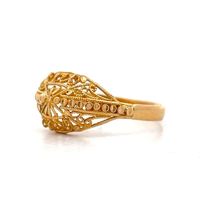 This exquisite modern filigree ring, crafted from 21 karat yellow gold, features an intricate design that highlights its rich, vibrant hue. The detailed filigree work is meticulously fashioned into delicate swirls and curves, creating a lace-like effect that captures and reflects light beautifully. This unique piece stands out whether worn alone or paired with other pieces, adding an artistic and sophisticated look to any ensemble. Ornate 14k Gold Filigree Ring With Intricate Design, Exquisite Filigree Ring With Intricate Design, Ornate Yellow Gold Ring For Ceremonial Occasions, Ornate Yellow Gold Ceremonial Ring, Ornate Yellow Gold Filigree Ring With Intricate Design, Gold Ornate Filigree Ring With Intricate Design, Ornate Gold Filigree Ring For Anniversary, 22k Gold Filigree Wedding Ring, Ornate Gold Filigree Ring With Intricate Design