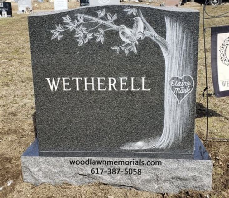 the headstone of wetherell is shown in front of an old cemetery sign