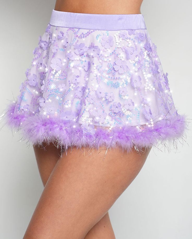 Your wishes are granted with the Genie Dust Floral Sequin Marabou Skirt! Crafted from a stunning purple fabric adorned with shimmering floral sequins and tinsel marabou hem, this magical skirt is your portal to a dreamy fairy tale adventure. 100% Nylon Hand wash cold Thick waistband Purple Party Bottoms For Spring, Purple Bottoms For Spring Party, Fitted Purple Bottoms For Party Season, Purple Sequined Party Skirt, Fitted Purple Sequin Skirt, Purple Party Skirt For Spring, Purple Lined Party Skirt, Spring Party Skirt In Purple, Purple Lined Skirt For Party