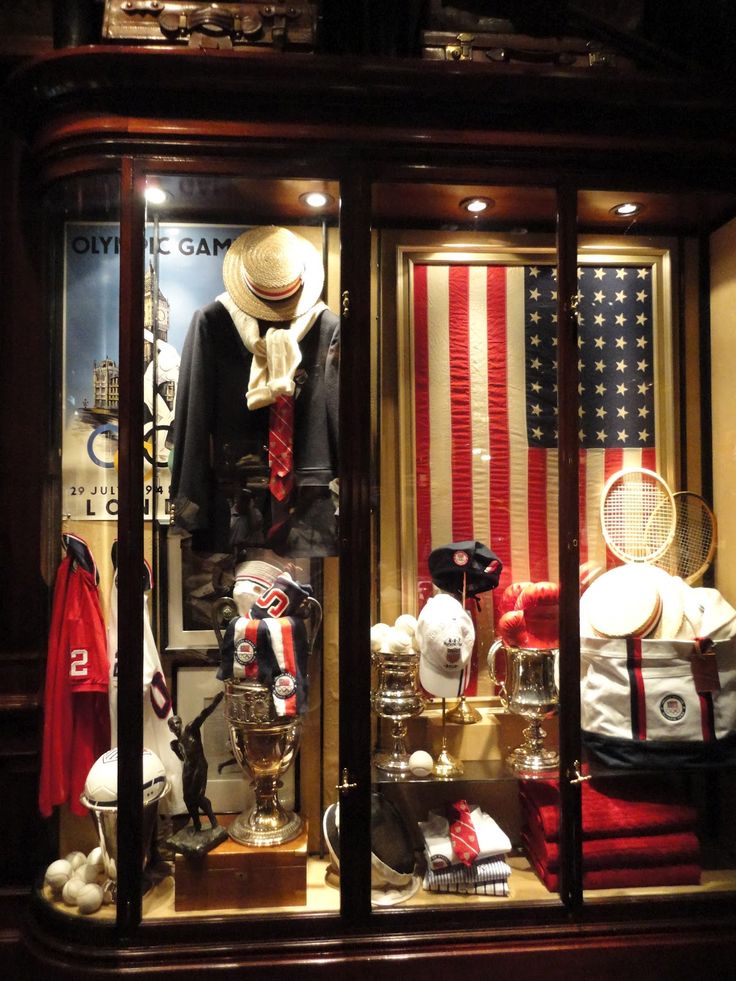 an image of a store window display with american flags