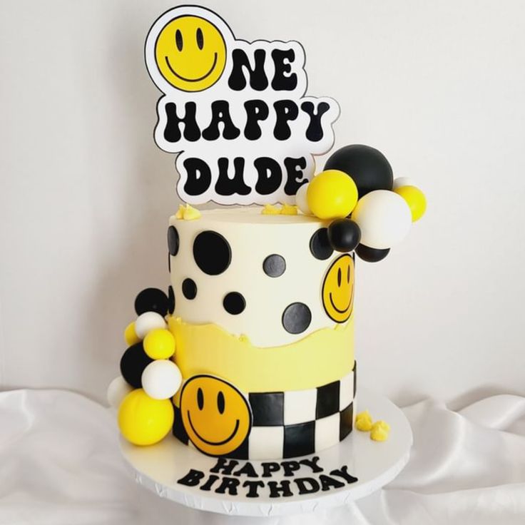 a birthday cake decorated with smiley faces and balloons for a one - happy dude party