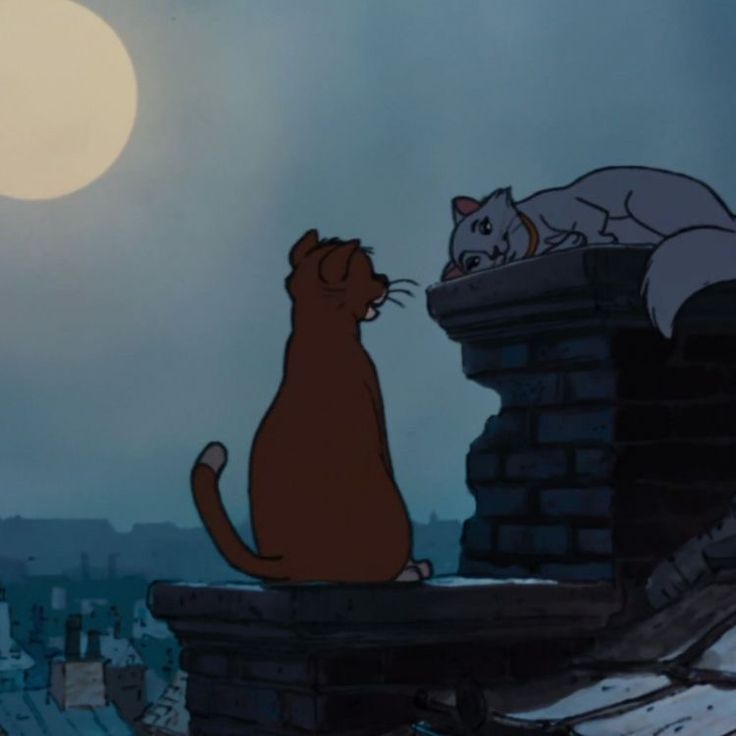 the cat and the mouse are sitting on top of a roof looking at each other