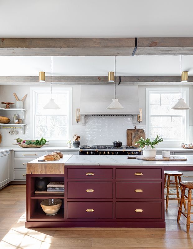 a kitchen with an island, stove and cabinets in it's center area is shown