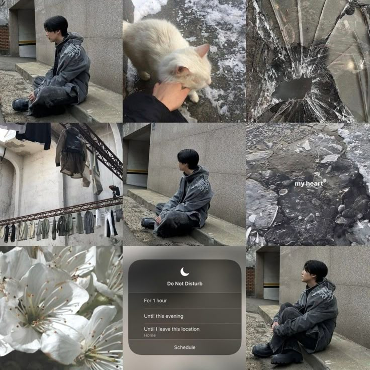 a man sitting on the ground next to flowers