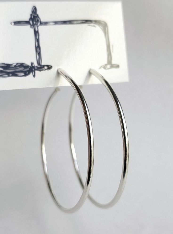 Sterling silver hoop earrings. These may be slightly heavier then average hoop earrings. They will be comfortable for every day wear. These are hand formed, one by one, so both will be different. Each one will have a unique quality, but are made around the same shape as displayed. **Earrings are made to order, and will be a new set of handmade earrings rather than the ones displayed. These are sawed, filed, sanded, and polished. These feel soft and smooth to the touch. All processes are completed by hand and with love. This item will come in a gift box. It may take 1-2 weeks to ship, and will arrive by USPS. Sterling Silver Hoop Earrings, Sterling Silver Hoops, Be Different, One By One, Silver Hoops, New Set, Silver Hoop Earrings, Handmade Earrings, Every Day