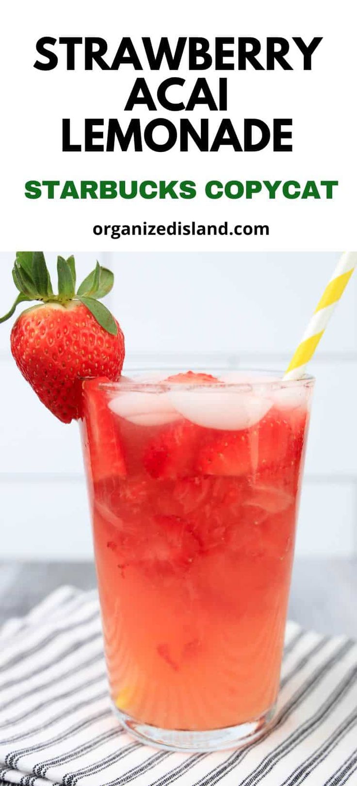 strawberry acai lemonade in a glass with strawberries on the rim and text overlay