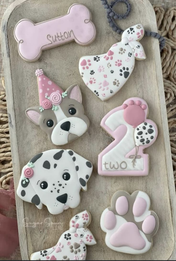 decorated cookies in the shape of dogs and numbers