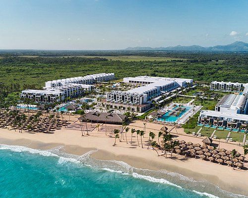 an aerial view of the resort and beach