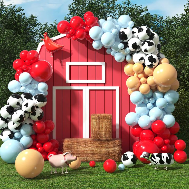 a red barn decorated with balloons and farm animals