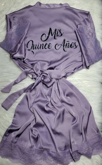 a purple robe with the words miss quince aies on it