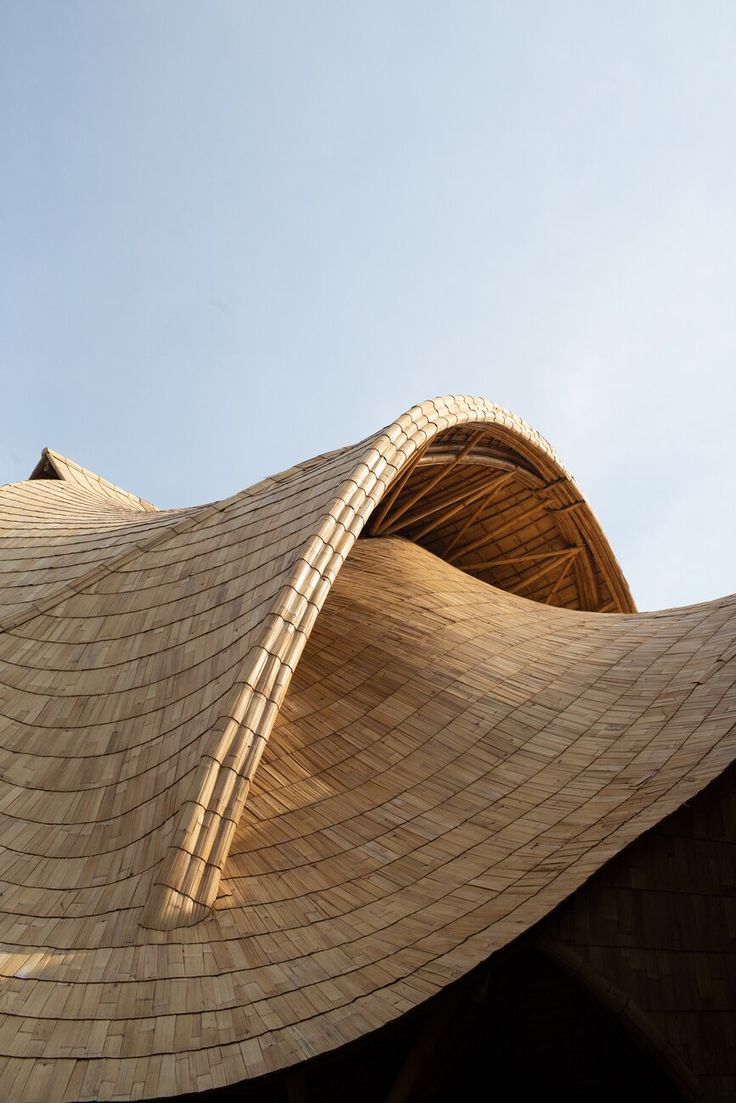 the top of a building with a curved roof