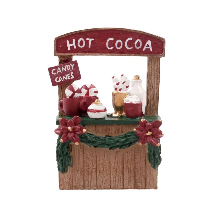 a hot cocoa stand with candy canes on it