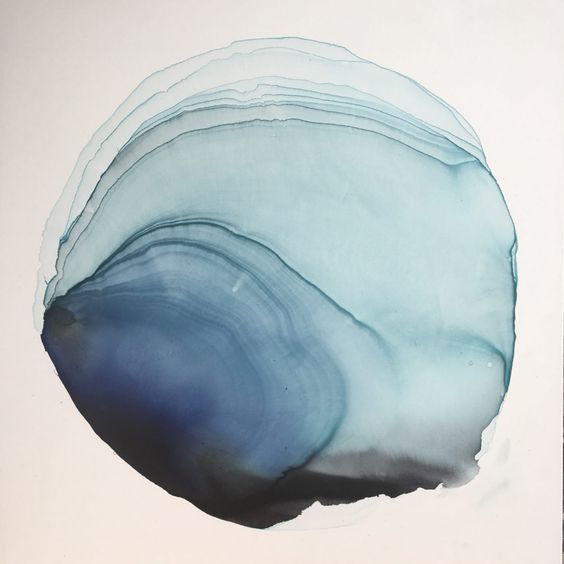 an abstract piece of art with blue and white paint on it's surface, in the shape of a circle