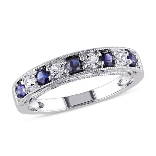 a white gold ring with blue and clear stones