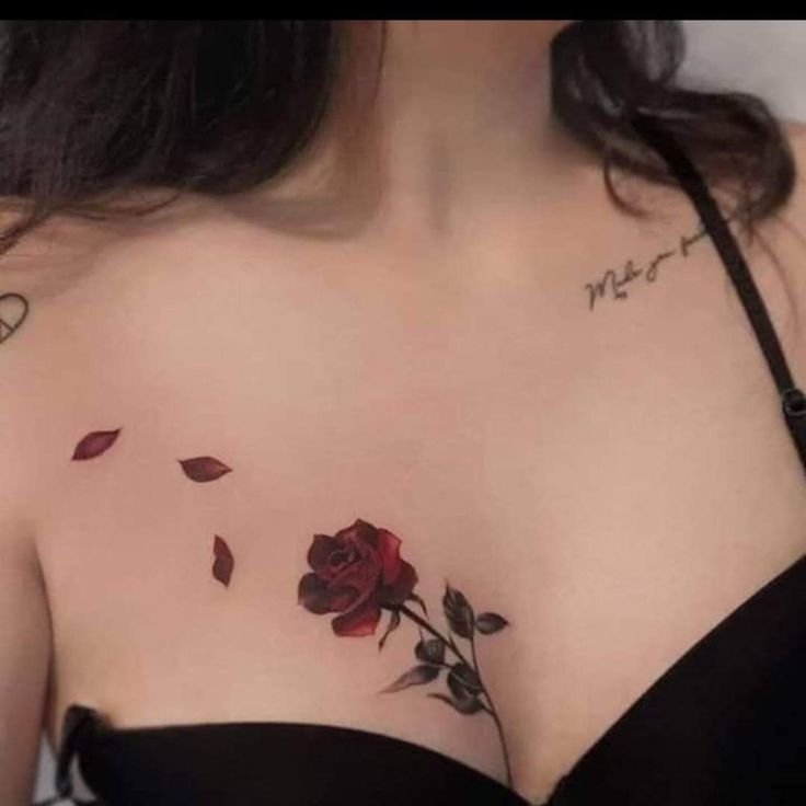 a woman with a rose tattoo on her chest