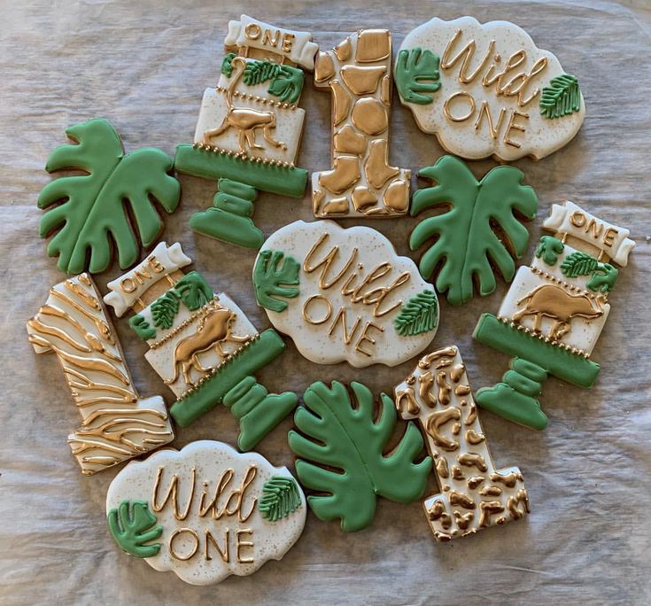 decorated cookies with palm trees, giraffes and words on them are arranged in a circle