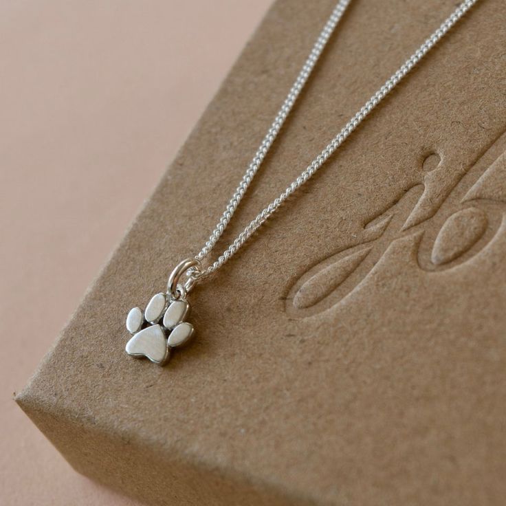 Please allow 10-15 days for production and delivery if item is not in stock.  Description:  Show your love and appreciation for dogs with one of these paw pendant necklaces; each pendant features an intricately detailed, realistic paw design. Perfect for everyday wear and special occasions. Details:  Materials: Gold Vermeil (Rose or Yellow) or Sterling Silver Paw Dimensions: 1cm Chain Length: 18" Chain Style: Fine Curb Dog Paw Jewelry, Paw Pendant, Mangalsutra Bracelet, Paw Jewelry, Safety Pin Brooch, Paw Design, Dog Pendant, Dog Necklace, Dog Charms