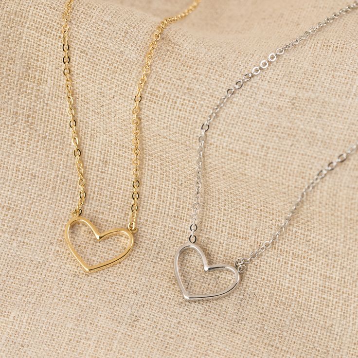 Our Heart Necklace is the epitome of understated elegance, offering a subtle yet powerful expression of love in its simplest form - a heart. This dainty heart necklace, featuring the delicate outline of a heart on a fine but sturdy chain, is more than just a piece of jewelry; it’s a symbol of the enduring nature of love in all its forms.Designed for versatility, this minimalist necklace seamlessly complements both casual and formal attire, making it a perfect choice for everyday wear or special Minimalist Delicate Chain Charm Necklace For Valentine's Day, Minimalist Everyday Heart Necklace With Adjustable Chain, Classic Necklace With Delicate Chain For Valentine's Day, Everyday 14k Gold Open Heart Charm Necklace, Dainty Heart Necklace With Adjustable Chain For Everyday, Simple Heart Necklace With Delicate Chain For Everyday, Delicate Heart Necklace With Adjustable Chain, Delicate Heart Necklace With Delicate Chain, Minimalist 14k Gold Double Heart Necklace