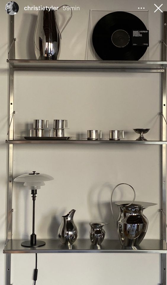 a shelf with various items on it in a room