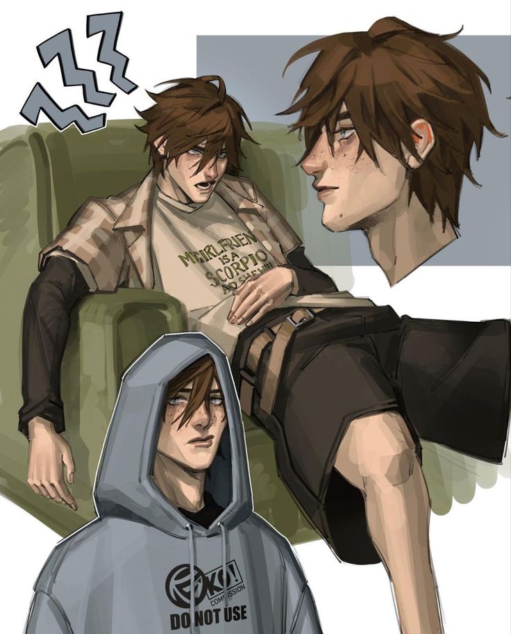 two people sitting on a couch with one person wearing a hoodie and the other looking at